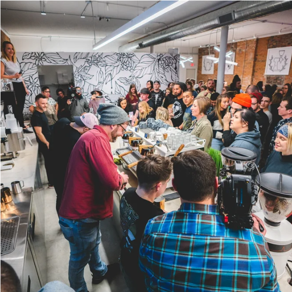 large group of people ordering coffee at 392Caffe Coffee house